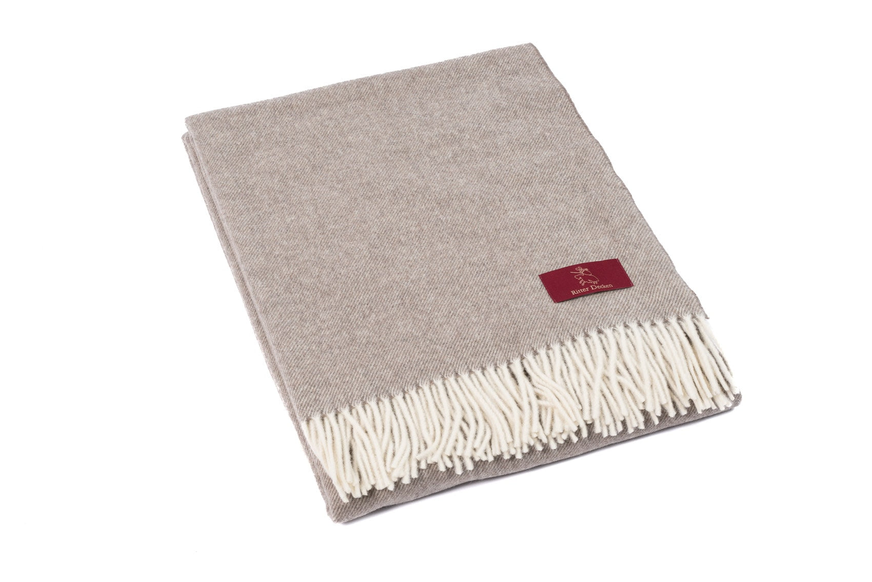 Gefaltetes Catania Schurwollplaid in hellbraun meliert Wohndecke Tagesdecke