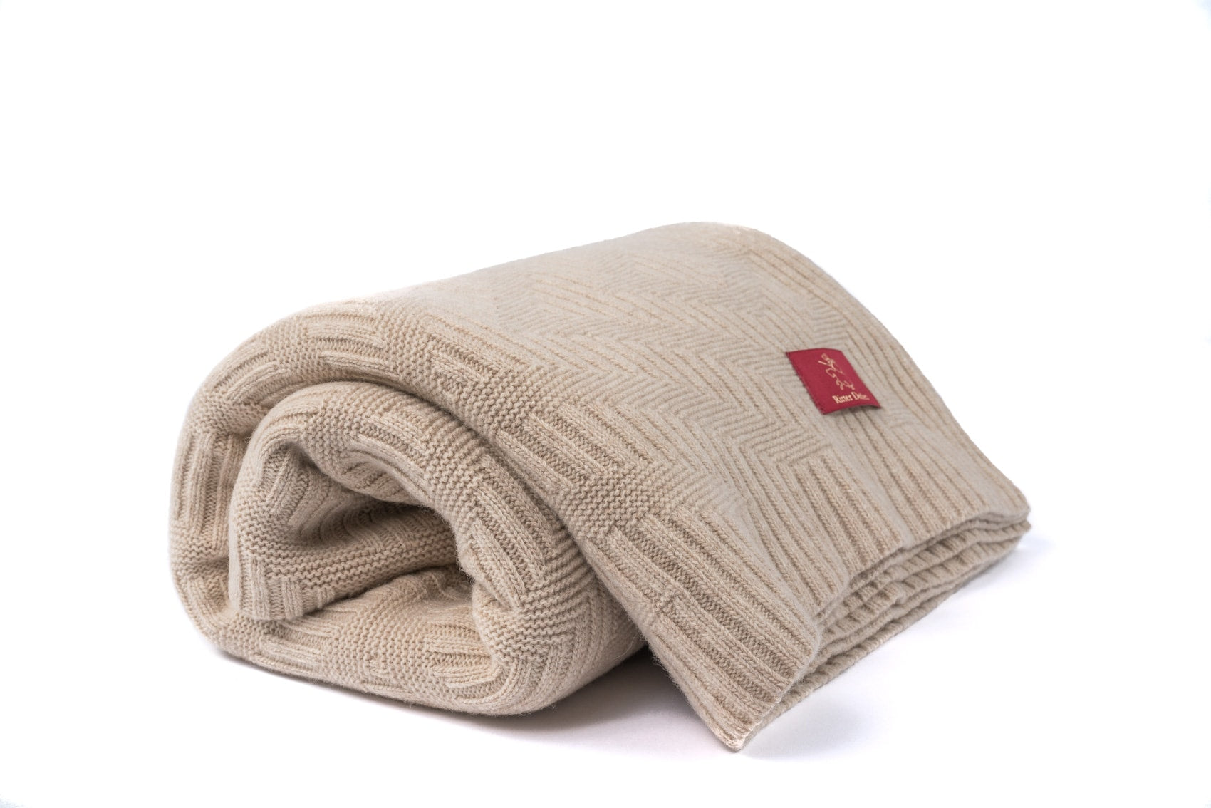 Gefaltetes Porto Strickplaid aus Schurwolle in beige